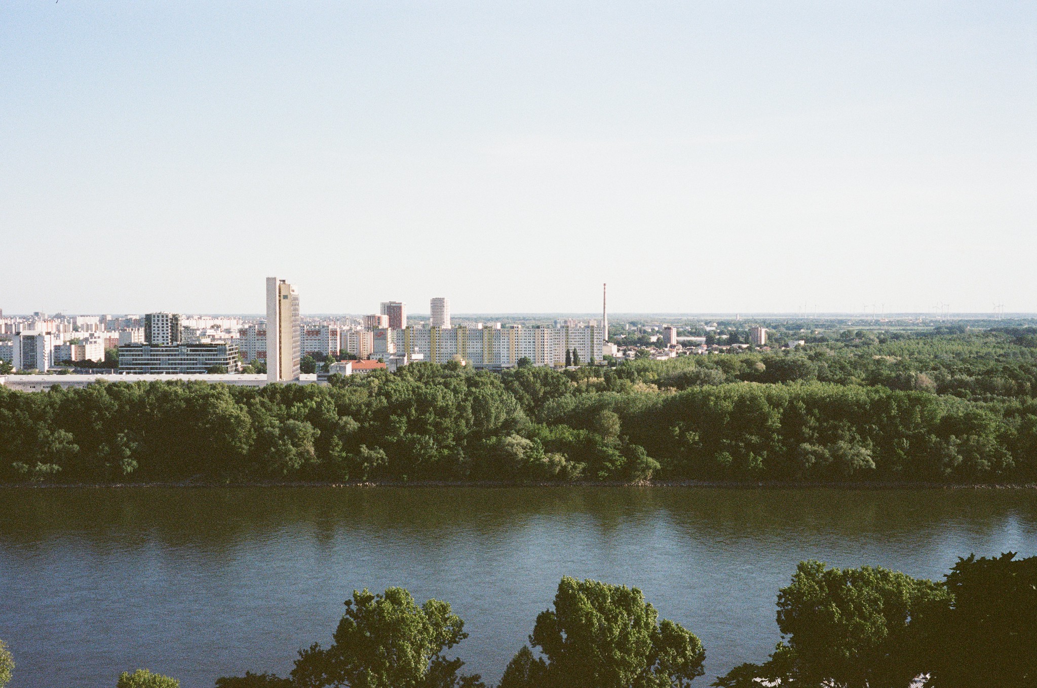 View across the Danube to the western part of the city from south-western Bratislava. The floodplain merges seamlessly into the suburb with its apartment blocks.